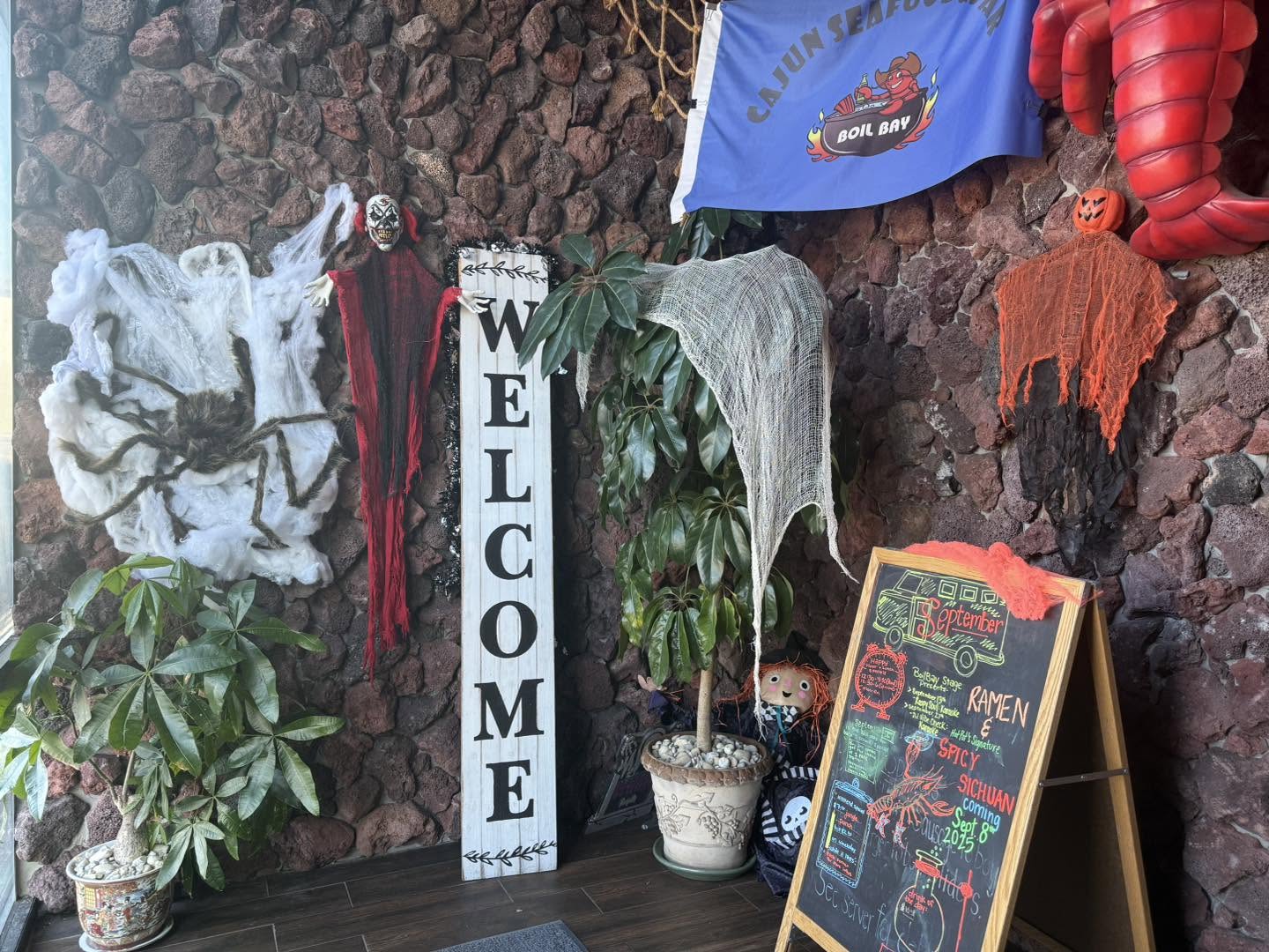 Boil Bay Virginia Beach restaurant entrance with welcome sign